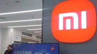 服装连锁店logo撞脸小米 客服回应：总公司设计的